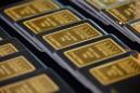 Firm dollar, fading stimulus hopes put gold on course for weekly loss