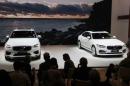 Automakers unveil new SUVs at New York auto show but also focus on EVs