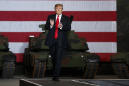 Trump visits tank factory and renews attack on war hero McCain