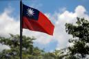Taiwan charges ex-officer, father with spying for China