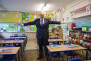 UK leader urges parents to let kids to return to school
