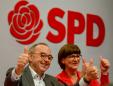Germany's SPD shifts left but gives Merkel coalition 'a chance'