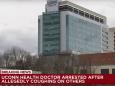 A Connecticut doctor has been charged after authorities said he deliberately coughed on his coworkers