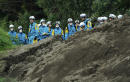 Japan quake toll up to 20 as rescuers dig through landslides