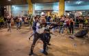 Hong Kong protesters clash with police as 44 activists charged with rioting