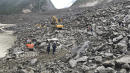 15 dead, scores missing hours after landslide buries Chinese village