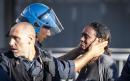 Police officer pictured comforting refugee during eviction protests in Rome 