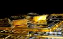 Gold drops as dollar rises on Fed's upbeat economic view