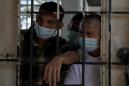 Mass arrests and overcrowded prisons in El Salvador spark fear of coronavirus crisis
