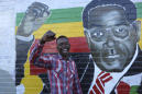The Latest: Zimbabwe army says Mugabe working on 'solution'