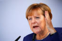 Merkel vows to restrict trade with Turkey over arrests