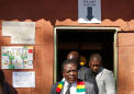 Zimbabwe's president, opponent both confident of win after close vote
