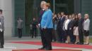 Angela Merkel Opts to Sit at Ceremony After Third Bout of Shaking