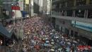 Chanting Anti-Beijing Slogans, Protesters Defy a Police Ban to March Through Downtown Hong Kong