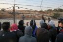 Through the wire -- Palestinians risk all to work in Israel