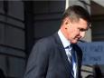 Federal judge halts the Justice Department's effort to drop its case against Michael Flynn