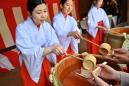 With sake and Shinto rites, Japanese see in new era