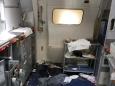 Delta Air Lines: Flight attendant breaks two wine bottles on man's head as he fights to open hatch, court documents reveal