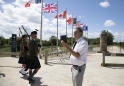 One man lays wreaths in Normandy on this unusual D-Day