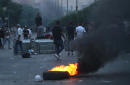 The Latest: Protests in Iraq leave 2 dead, scores wounded