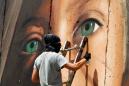 Israel releases Italians who painted mural of Palestinian teen