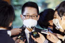 Japan PM meets top SKorea official, urges Seoul to solve row