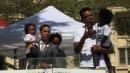 Rally seeks justice for black man shot by police in backyard