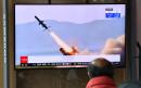 North Korea fires barrage of missiles from ground and air