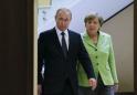 Putin, Merkel struggle to move past differences in tense meeting