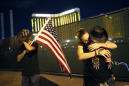 Dimmed lights, somber tributes on Vegas shooting anniversary