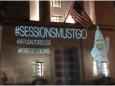 Jeff Sessions in KKK robe image projected onto Justice Department headquarters