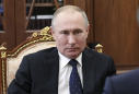 Putin approves law that could keep him in power until 2036