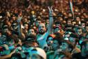 Protesters in Iraq celebrate soccer win against Iran