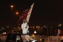 Thousands greet Qatar's emir on return home