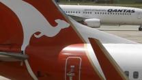 Qantas looks beyond record loss