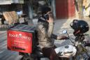 Afghan delivery men feel pressure as online sales rise