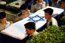 Israel to free two prisoners after recovering soldier's remains from Syria