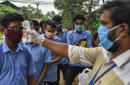 The Latest: India reports biggest jump in virus cases again