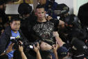 Ex-guard frees dozens of hostages in Manila mall, is subdued