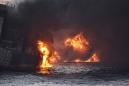 China races to tackle expanding oil spill after tanker sinks