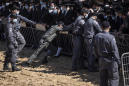 Israeli police clash with mourners at rabbi's funeral