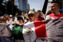 Shootings in northern Mexico town kill 20, pile pressure on president