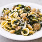 Pasta loaded with tender bites of sausage, kale and beans