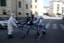 Italy's coronavirus deaths push higher, new cases hold steady