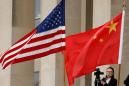China denies report it may detain Americans, says U.S. mistreats its scholars