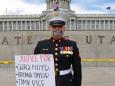 A US Marine veteran stood outside the Utah Capitol with the words 'I can't breathe' taped over his mouth for so long that his shoes started melting into the ground