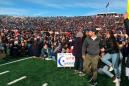 Harvard-Yale football game grinds to halt as hundreds of students storm field to protest climate change