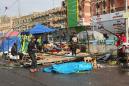 Iraq protest tents set ablaze after cleric withdraws support