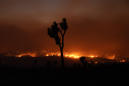 Crews make progress against enormous LA-area wildfire