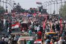 The Latest: Iraq's president calls for new election law